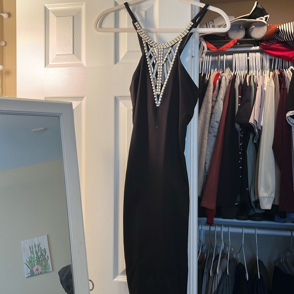 Black mini dress with rhinestone and studded neckline
